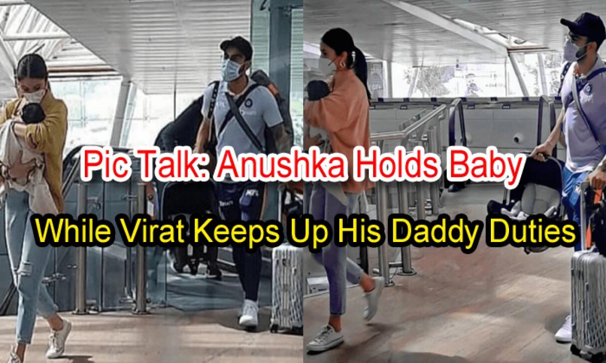  Pic Talk: Anushka Holds Baby While Virat Keeps Up His Daddy Duties-TeluguStop.com